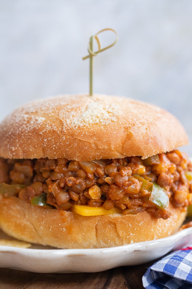vegetarian sloppy joe on a plate with a toothpick stuck in the top