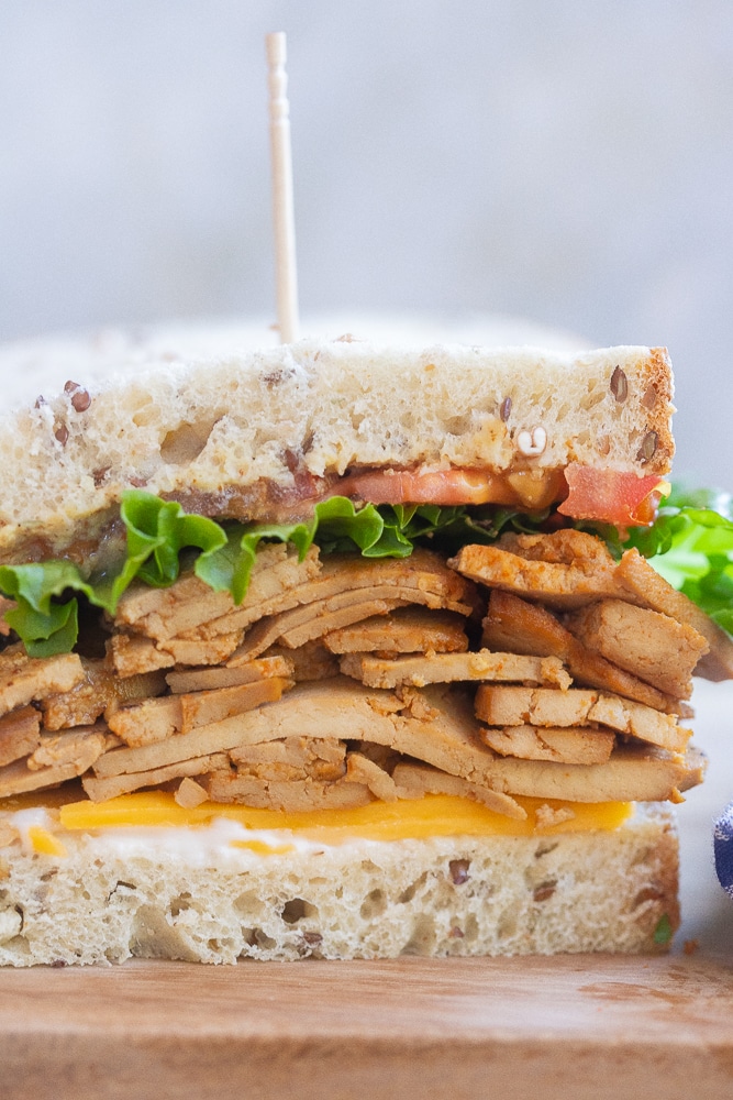 Close up of vegan tofu meat inside of a sandwich