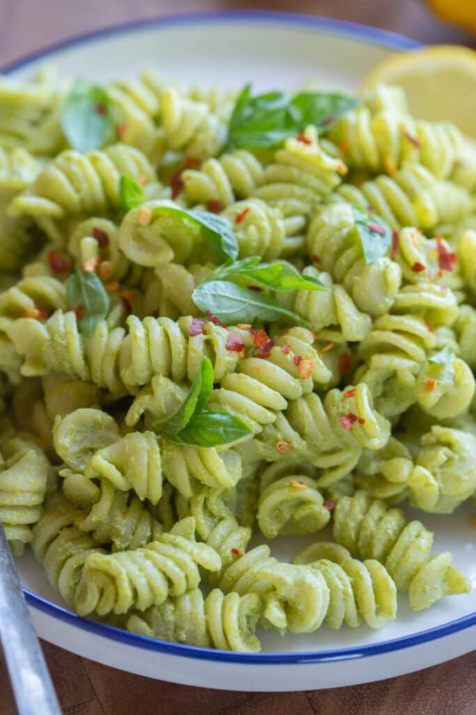 Close up of a plate full of creamy lemon basil pasta