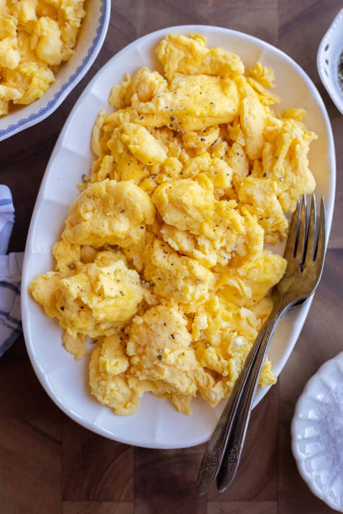 Serving platter of scrambled eggs with black pepper