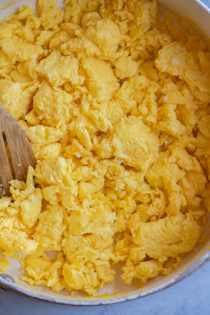 fluffy scrambled eggs in a pan
