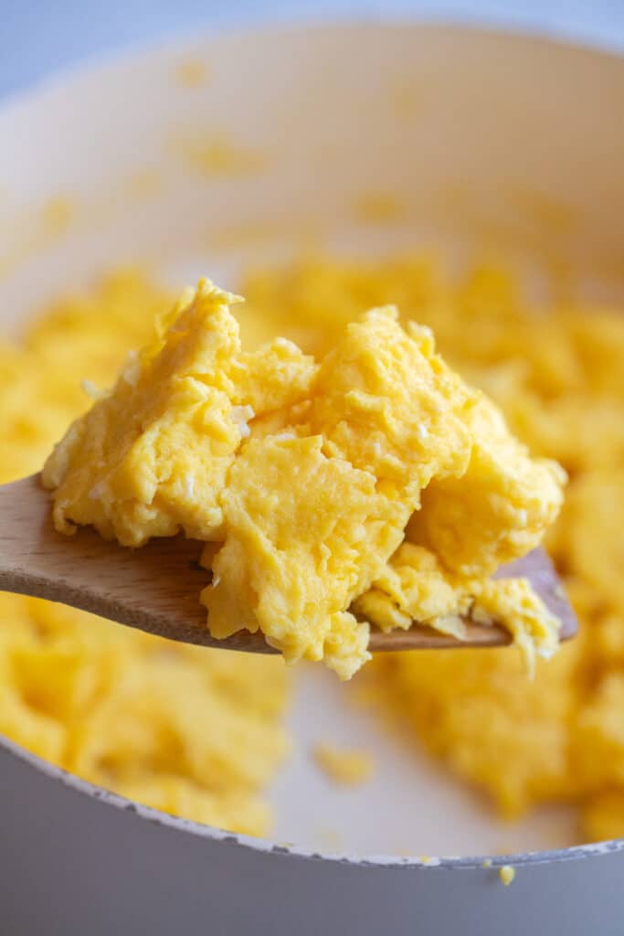 fluffy chunks of scrambled eggs on a spatula