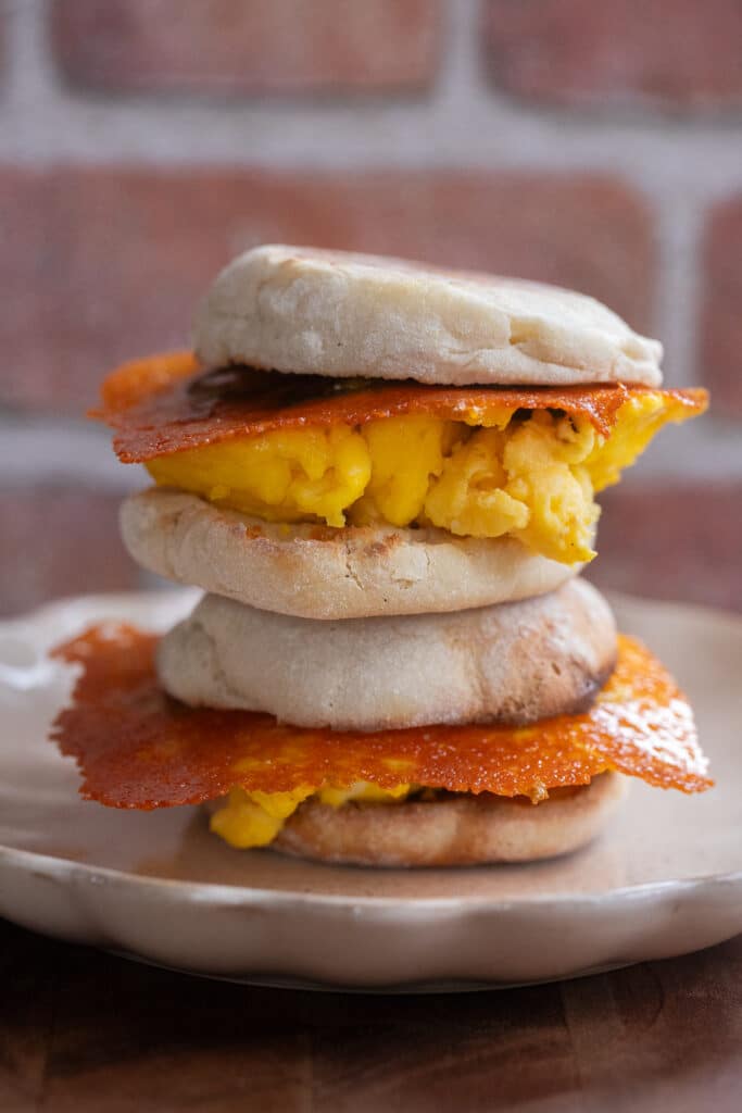 Two crispy cheese and egg sandwiches stacked on top of each other