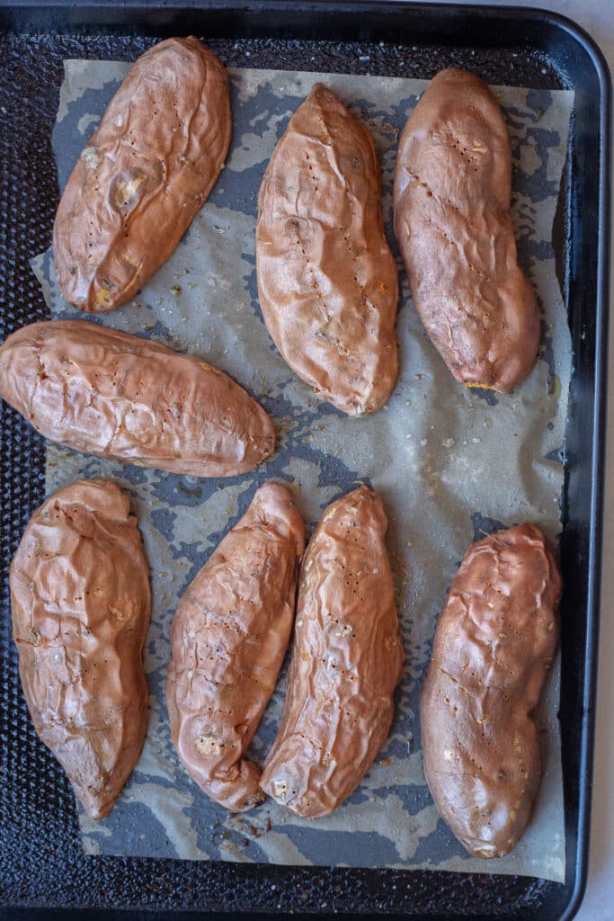 roasted sweet potatoes on a sheet pan