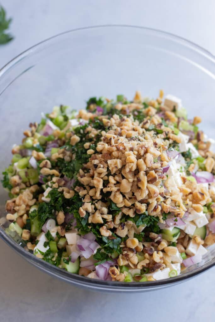all sweet pea salad ingredients together in a mixing bowl