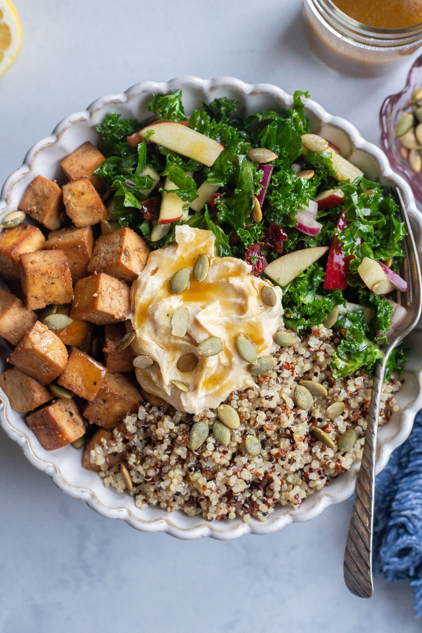 Serving bowl full of fall balsamic tofu quinoa bowl ingredients