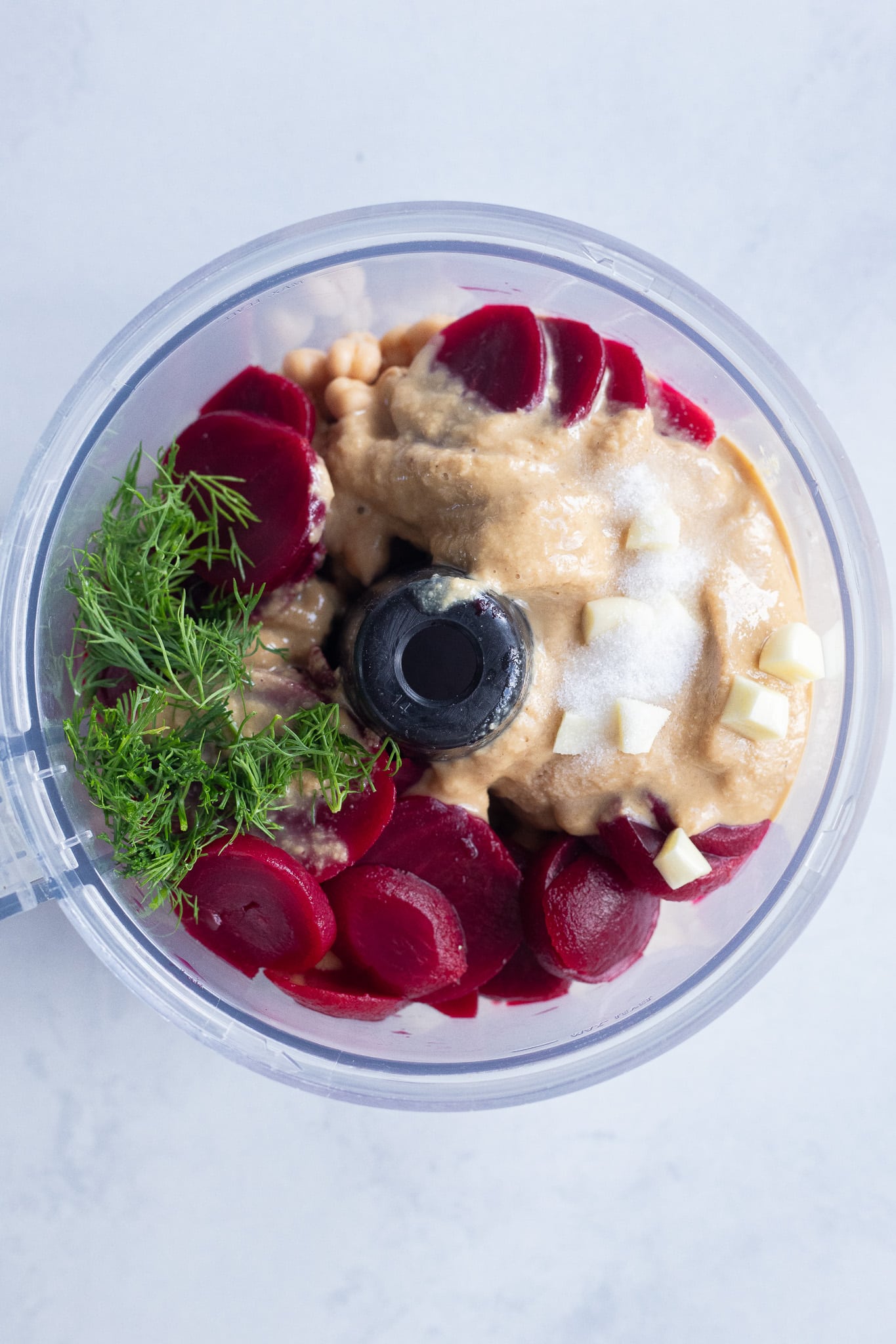 beet hummus ingredients in a food processor