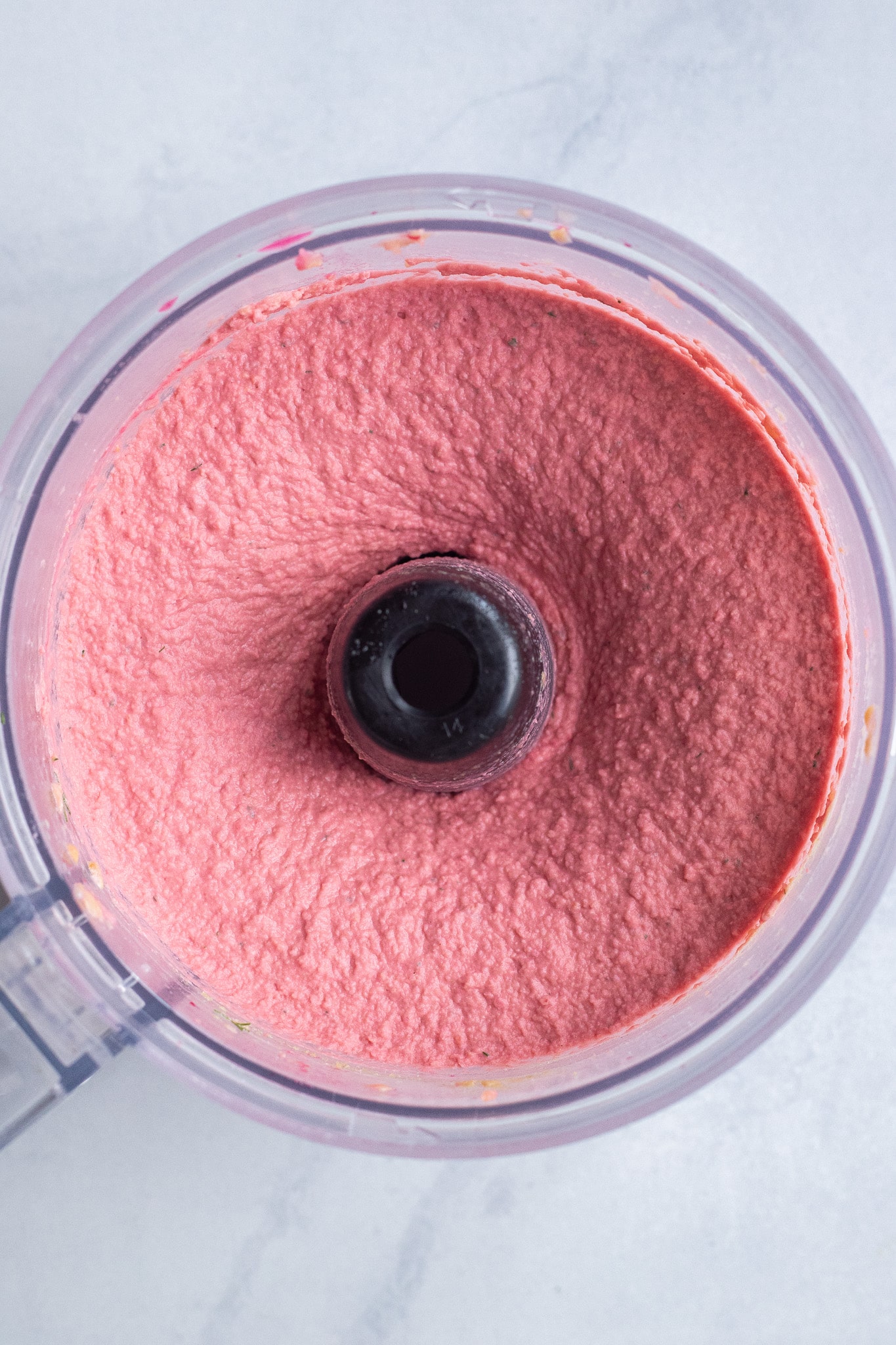 pink beet hummus in a food processor